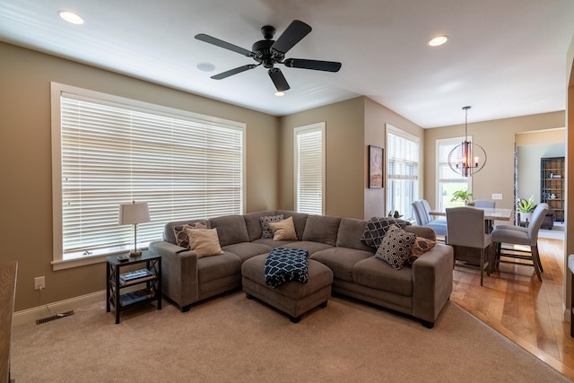 60515 235th St, Madison Lake, MN 56063 - living room featuring a chandelier, recessed lighting, ceiling fan, and light carpet