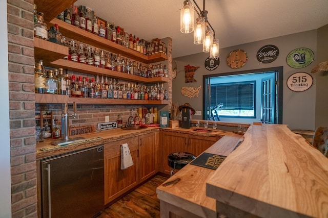 60515 235th St, Madison Lake, MN 56063 - indoor wet bar with dark wood-style floors, fridge, and decorative light fixtures