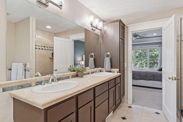 4312 France Ave S, Edina, MN 55410 - full bathroom featuring double vanity, connected bathroom, a ceiling fan, tile patterned flooring, and recessed lighting