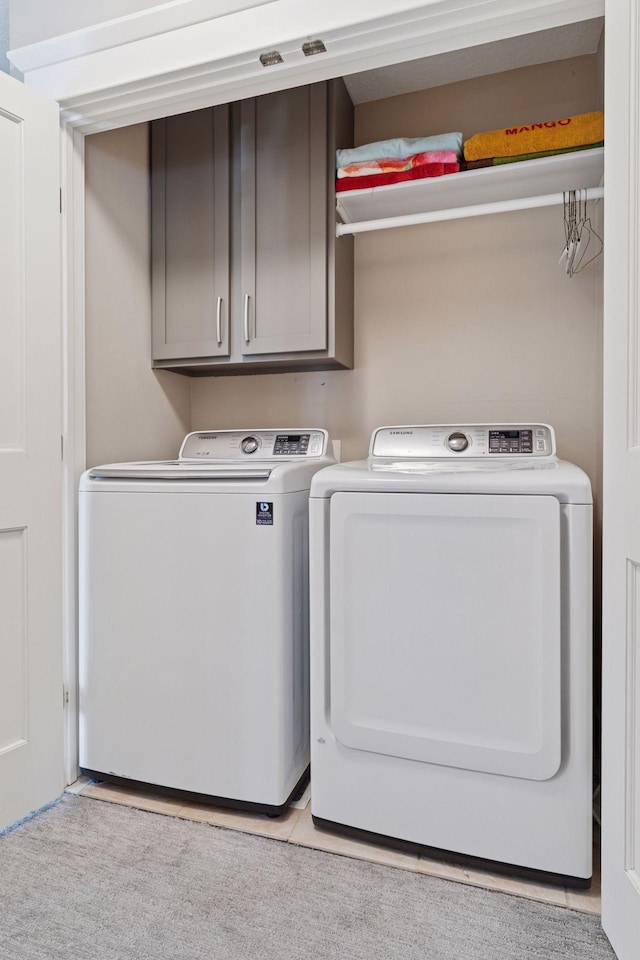 4312 France Ave S, Edina, MN 55410 - laundry area featuring cabinet space and washer and clothes dryer