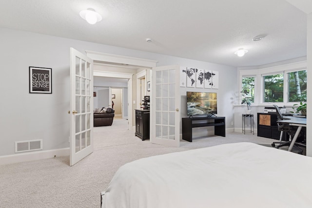 4312 France Ave S, Edina, MN 55410 - carpeted bedroom featuring french doors, a textured ceiling, and an office area