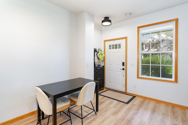 14399 Banyan Ln, Rosemount, MN 55068 - dining area featuring light wood-style floors and baseboards