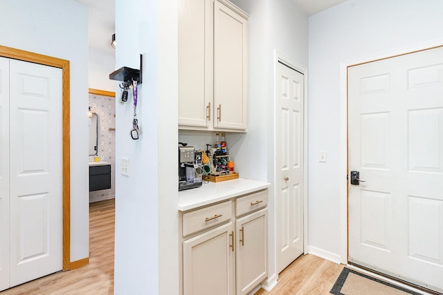 14399 Banyan Ln, Rosemount, MN 55068 - bar featuring light wood finished floors and baseboards