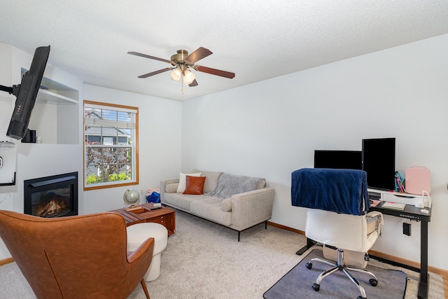 14399 Banyan Ln, Rosemount, MN 55068 - office area with carpet, a ceiling fan, and a glass covered fireplace