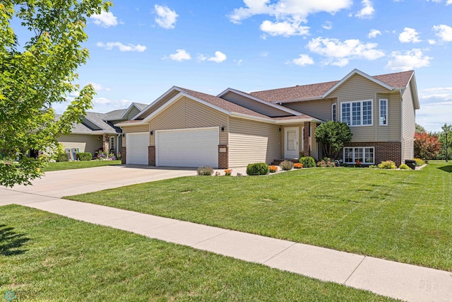 4515 Westport Pkwy, Fargo, ND 58078 - tri-level home featuring brick siding, a garage, concrete driveway, a front lawn, and roof with shingles