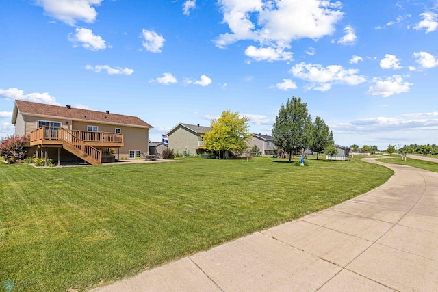 4515 Westport Pkwy, Fargo, ND 58078 - view of green lawn featuring a wooden deck and stairs