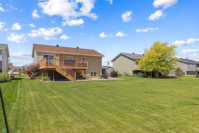 4515 Westport Pkwy, Fargo, ND 58078 - rear view of property with a wooden deck, stairs, a yard, and a patio