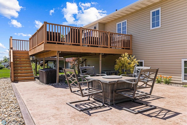 4515 Westport Pkwy, Fargo, ND 58078 - view of patio with a deck, stairs, and an outdoor fire pit