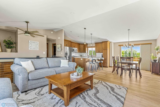 4515 Westport Pkwy, Fargo, ND 58078 - living area featuring light wood-style flooring, lofted ceiling, a ceiling fan, a chandelier, and recessed lighting