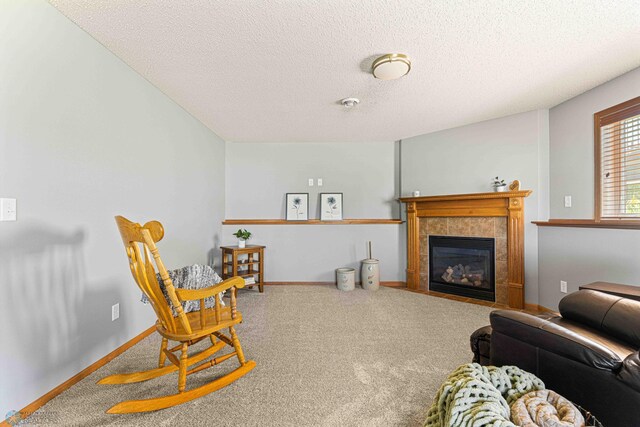 4515 Westport Pkwy, Fargo, ND 58078 - living room with a textured ceiling, carpet floors, and a tile fireplace