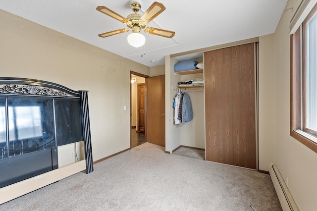 3850 Plymouth Blvd Unit 204, Plymouth, MN 55446 - unfurnished bedroom featuring a baseboard radiator, carpet flooring, a closet, and multiple windows