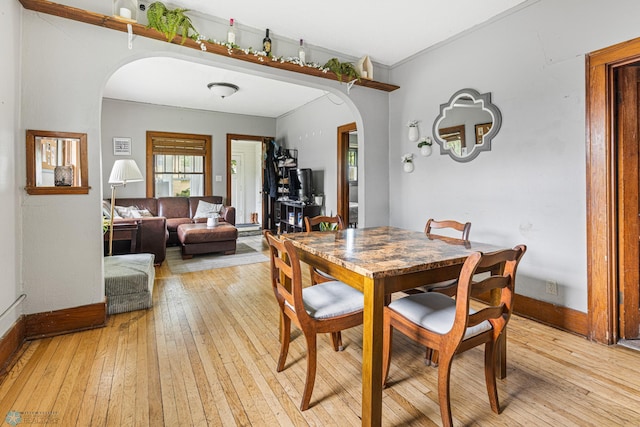 1329 12th St N, Fargo, ND 58102 - dining area featuring arched walkways and light wood-style floors