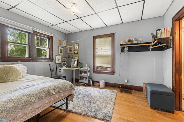 1329 12th St N, Fargo, ND 58102 - bedroom featuring a paneled ceiling and wood finished floors