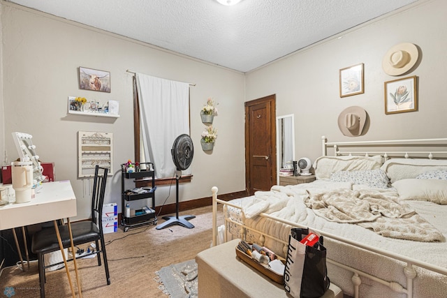 1329 12th St N, Fargo, ND 58102 - bedroom with light colored carpet, a textured ceiling, and a desk