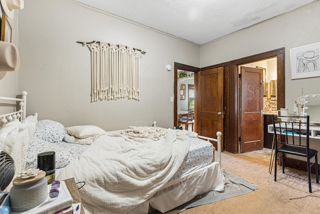 1329 12th St N, Fargo, ND 58102 - bedroom featuring light carpet and a textured ceiling