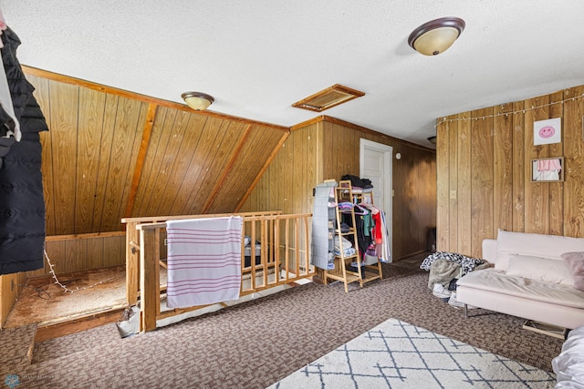 1329 12th St N, Fargo, ND 58102 - bedroom featuring wooden walls, carpet flooring, and attic access
