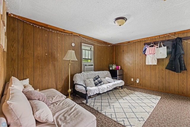 1329 12th St N, Fargo, ND 58102 - living area featuring a textured ceiling, wooden walls, carpet flooring, and cooling unit