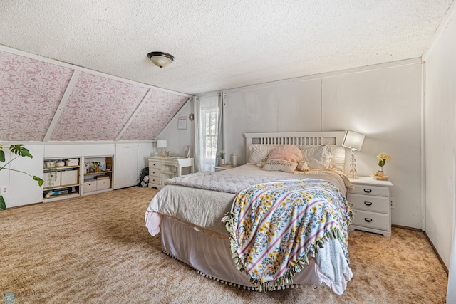 1329 12th St N, Fargo, ND 58102 - carpeted bedroom with vaulted ceiling and a textured ceiling