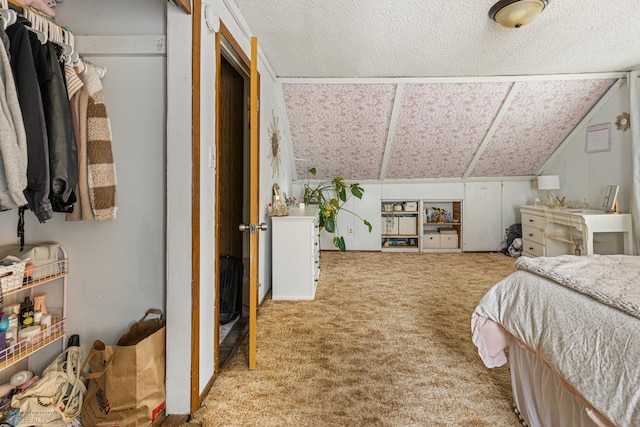 1329 12th St N, Fargo, ND 58102 - carpeted bedroom with a textured ceiling and vaulted ceiling
