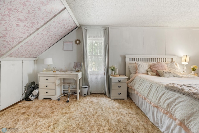 1329 12th St N, Fargo, ND 58102 - bedroom featuring vaulted ceiling, carpet flooring, and a textured ceiling