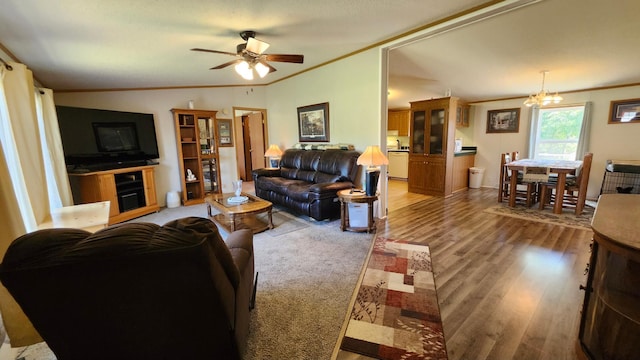 3665 Fox Ln, Pequot Lakes, MN 56472 - living room with crown molding, a ceiling fan, wood finished floors, and a chandelier