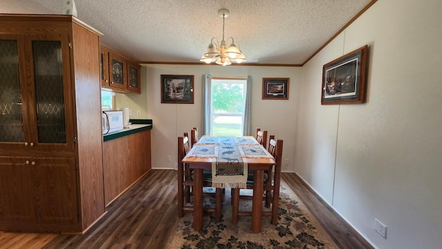 3665 Fox Ln, Pequot Lakes, MN 56472 - dining area featuring dark wood finished floors, a chandelier, a textured ceiling, and crown molding