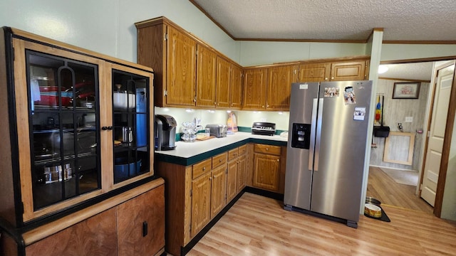 3665 Fox Ln, Pequot Lakes, MN 56472 - kitchen with stainless steel fridge, ornamental molding, light wood-type flooring, refrigerator, and a textured ceiling