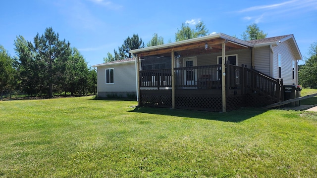 3665 Fox Ln, Pequot Lakes, MN 56472 - back of house with a lawn and a wooden deck