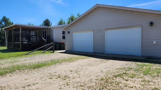 3665 Fox Ln, Pequot Lakes, MN 56472 - view of side of property with a garage, an outbuilding, and a deck