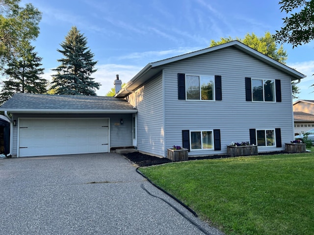401 Sigrid Dr, Buffalo, MN 55313 - tri-level home with a garage, a front lawn, driveway, and a chimney