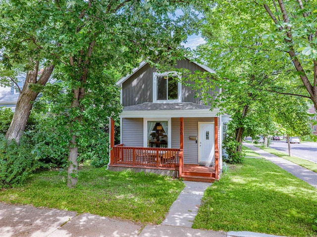 2700 Aldrich Ave N, Minneapolis, MN 55411 - traditional style home featuring a porch and a front yard