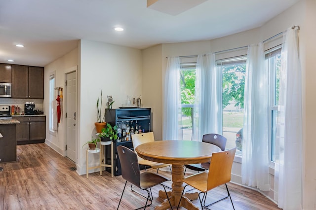2700 Aldrich Ave N, Minneapolis, MN 55411 - dining area with light wood-style flooring and recessed lighting