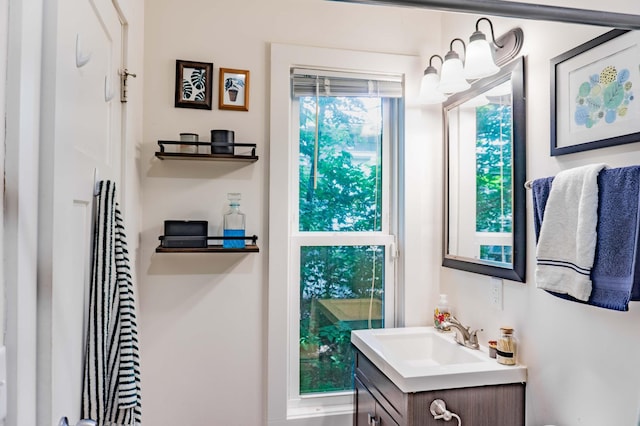 2700 Aldrich Ave N, Minneapolis, MN 55411 - bathroom featuring vanity and a chandelier
