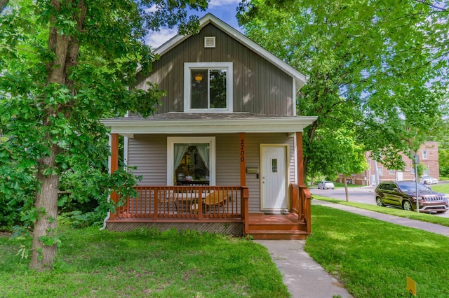 2700 Aldrich Ave N, Minneapolis, MN 55411 - view of front of property with a porch and a front lawn