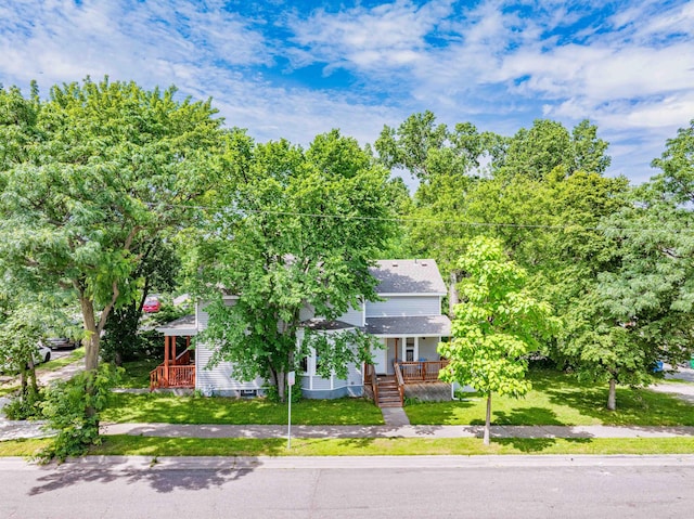 2700 Aldrich Ave N, Minneapolis, MN 55411 - view of front facade with covered porch and a front lawn