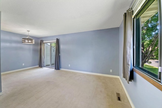 3615 156th St W, Rosemount, MN 55068 - carpeted empty room with a chandelier and a textured ceiling