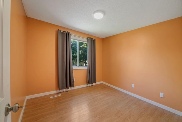 3615 156th St W, Rosemount, MN 55068 - unfurnished room featuring light wood-style floors and a textured ceiling