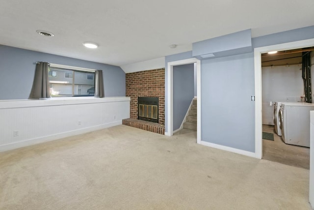 3615 156th St W, Rosemount, MN 55068 - unfurnished living room with washing machine and dryer, carpet floors, and a fireplace