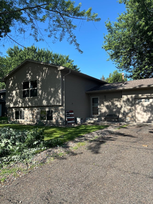 8993 Magnolia Ln N, Maple Grove, MN 55369 - view of side of home featuring a garage