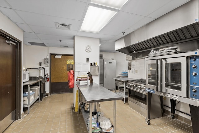 6615 Lake Shore Dr S Unit 314, Richfield, MN 55423 - kitchen with a paneled ceiling, appliances with stainless steel finishes, stainless steel counters, and tile patterned flooring