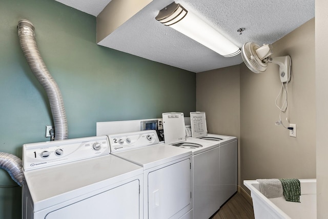 6615 Lake Shore Dr S Unit 314, Richfield, MN 55423 - washroom with independent washer and dryer, a textured ceiling, and dark wood finished floors