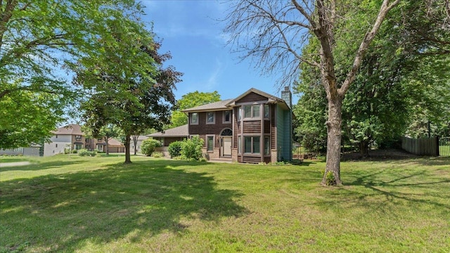 12720 Ibis St NW, Coon Rapids, MN 55448 - back of property featuring a chimney