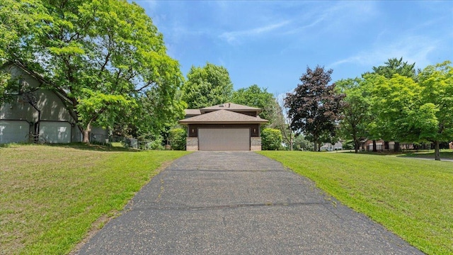 12720 Ibis St NW, Coon Rapids, MN 55448 - view of front of property featuring a front yard, a garage, and brick siding