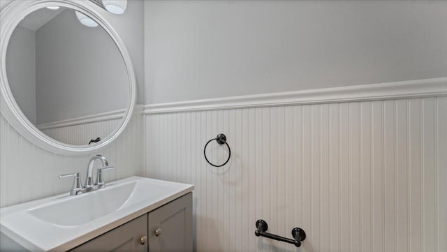 12720 Ibis St NW, Coon Rapids, MN 55448 - bathroom with vanity and a wainscoted wall