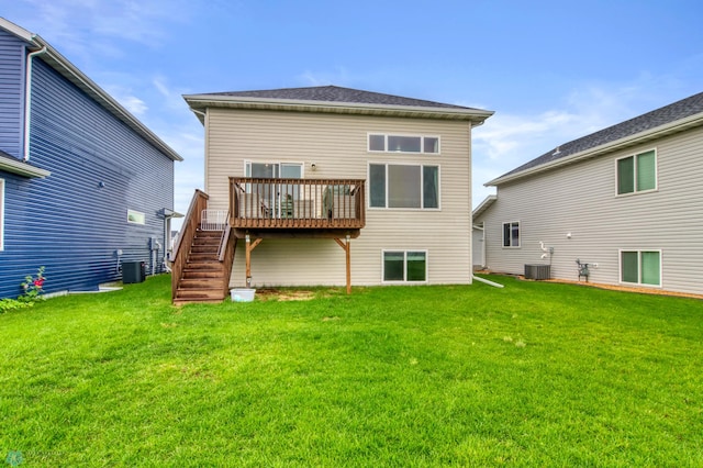 401 7th St E, Horace, ND 58047 - back of property with a wooden deck, a lawn, and stairs