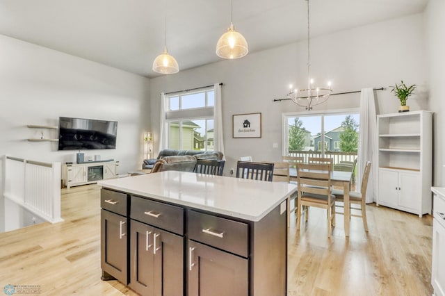 401 7th St E, Horace, ND 58047 - kitchen featuring light wood-type flooring, a chandelier, and light countertops