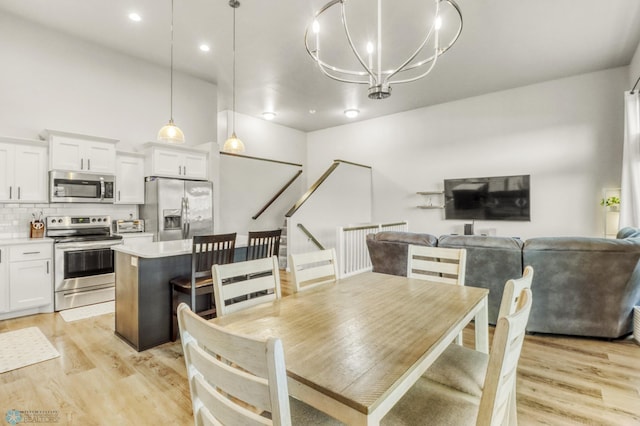 401 7th St E, Horace, ND 58047 - dining space featuring light wood-style flooring, a chandelier, and recessed lighting