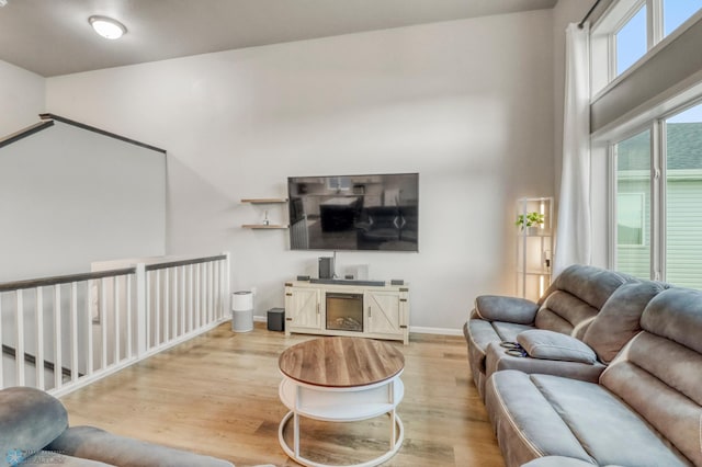 401 7th St E, Horace, ND 58047 - living area with wood finished floors and a high ceiling