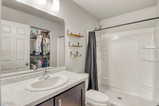 401 7th St E, Horace, ND 58047 - full bathroom with a shower with curtain, vanity, and a walk in closet