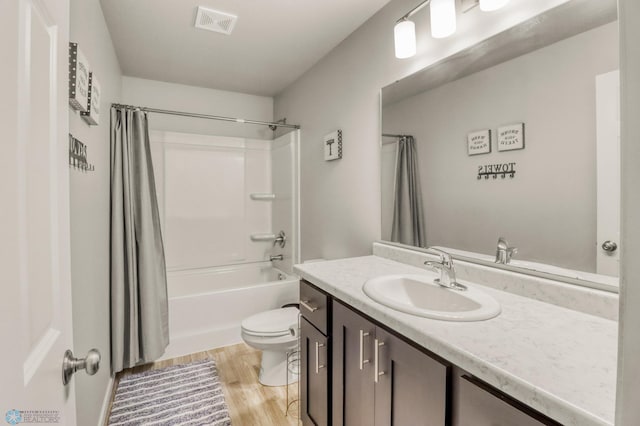 401 7th St E, Horace, ND 58047 - full bathroom featuring vanity, shower / tub combo with curtain, and wood finished floors